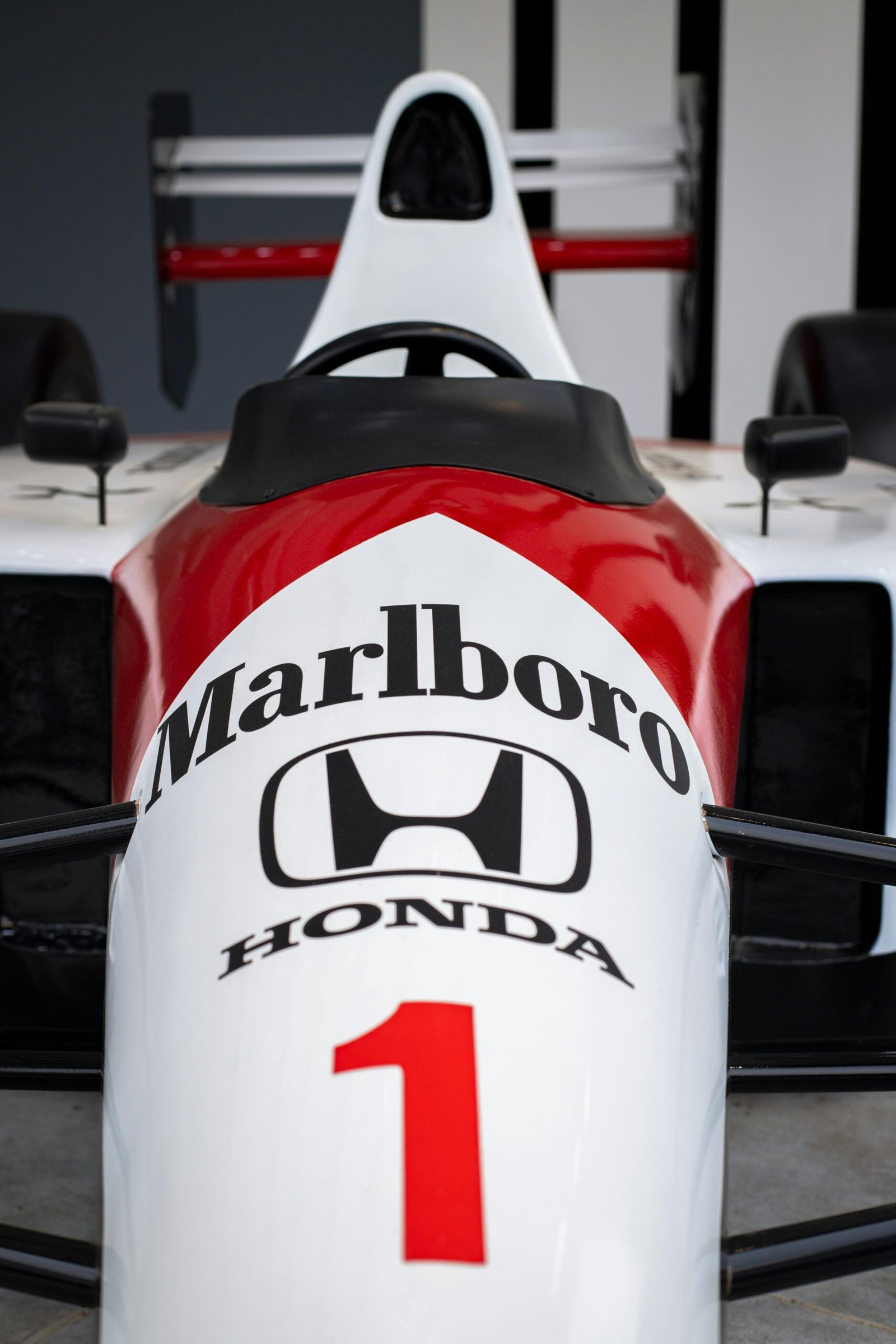 Close-up view of a vintage Formula 1 racing car showcasing iconic branding.